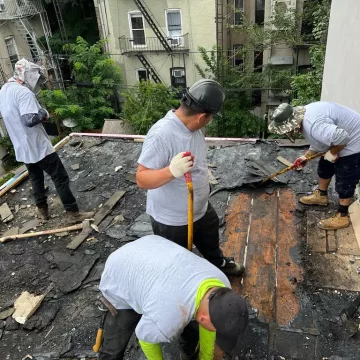 removing previously damaged roof and looking for any other damage.